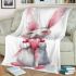 Cute cartoon bunny with a pink bow holding a heart blanket