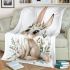 Cute cartoon bunny with big eyes sitting on the flowers blanket