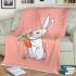 Cute cartoon rabbit playing with a carrot blanket