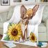 Cute chihuahua puppy with big eyes sitting next to sunflower blanket