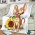 Cute chihuahua puppy with big eyes sitting next to sunflower blanket