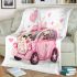 Cute pink car with a cute puppy inside blanket