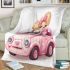 Cute pink car with a cute puppy inside blanket