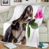 Cute valentine's day beagle puppy holding a pink rose blanket