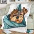 Cute yorkshire terrier dog peeking blanket