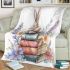 Rabbit sitting on top of books surrounded by flowers blanket