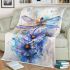 Watercolor dragonfly sitting on top of flower blanket