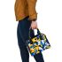 Abstract blue and yellow geometric masterpiece shoulder handbag