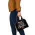 Abstract cityscape made of geometric shapes shoulder handbag