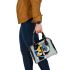 Abstract composition featuring bold shapes shoulder handbag