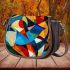 Abstract composition of colorful shapes saddle bag