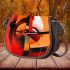 Abstract composition of geometric shapes in red saddle bag