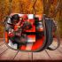 Abstract composition of geometric shapes in red saddle bag