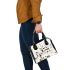 Abstract composition of houses simple shapes and lines shoulder handbag