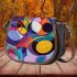 Abstract composition with geometric shapes and vibrant colors saddle bag