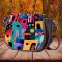 Abstract houses rich color palette saddle bag