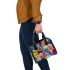 Abstract painting in the style of kandinsky with bright colors shoulder handbag