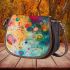 Abstract painting of circles and spheres saddle bag