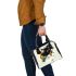 Abstract vector graphic shoulder handbag