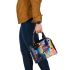 Abstract watercolor painting of the universe shoulder handbag