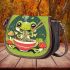 An adorable green frog eating ramen noodles saddle bag