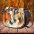 An impressionist painting of three horses saddle bag