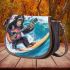 Baby chimpanzee surfing with guitar and musical notes saddle bag