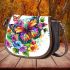 Beautiful colorful butterfly among flowers saddle bag