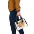 Bee on honeycomb with flowers around shoulder handbag