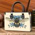 Bee with a blue flower on its back small handbag