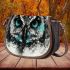 Black and white owl with turquoise highlights saddle bag