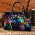 Black light poster of two rainbow sea turtles kissing small handbag