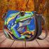 Blue and green frog with rainbow stripes saddle bag