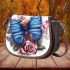 Blue butterfly surrounded by roses and flowers saddle bag