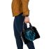 Blue owl sitting on dream catcher shoulder handbag