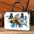 Bumblebee holding a blue forgetmenot flower small handbag