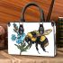 Bumblebee holding a blue forgetmenot flower small handbag