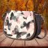 Butterflies and butterfly pattern in soft pink saddle bag