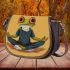 Cartoon frog with big eyes wearing white and brown shoes saddle bag