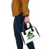 Cartoon green frog wearing black witch hat shoulder handbag