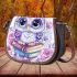 Cartoon owl with big eyes sitting on books surrounded by pink roses saddle bag