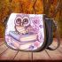 Cartoon owl with big eyes sitting on books surrounded by pink roses saddle bag