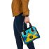 Circles and triangles in a blue sky shoulder handbag