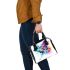 Colorful butterfly with floral elements shoulder handbag