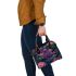 Colorful butterfly with flowers and leaves on purple shoulder handbag