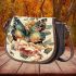 Colorful butterfly with flowers on its wings saddle bag