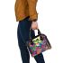 Colorful cute cartoon peacock frog sitting on top of an egg shoulder handbag