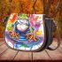 Colorful cute cartoon tree frog sits on a water puddle saddle bag