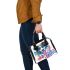 Colorful drawing of an adorable border collie shoulder handbag