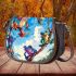 Colorful frogs hanging from tree branches in the jungle saddle bag